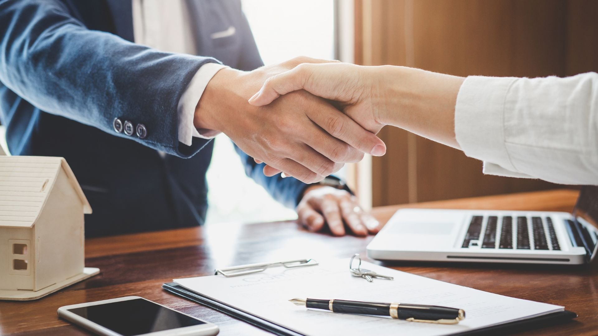 Property manager shaking hands with a satisfied client